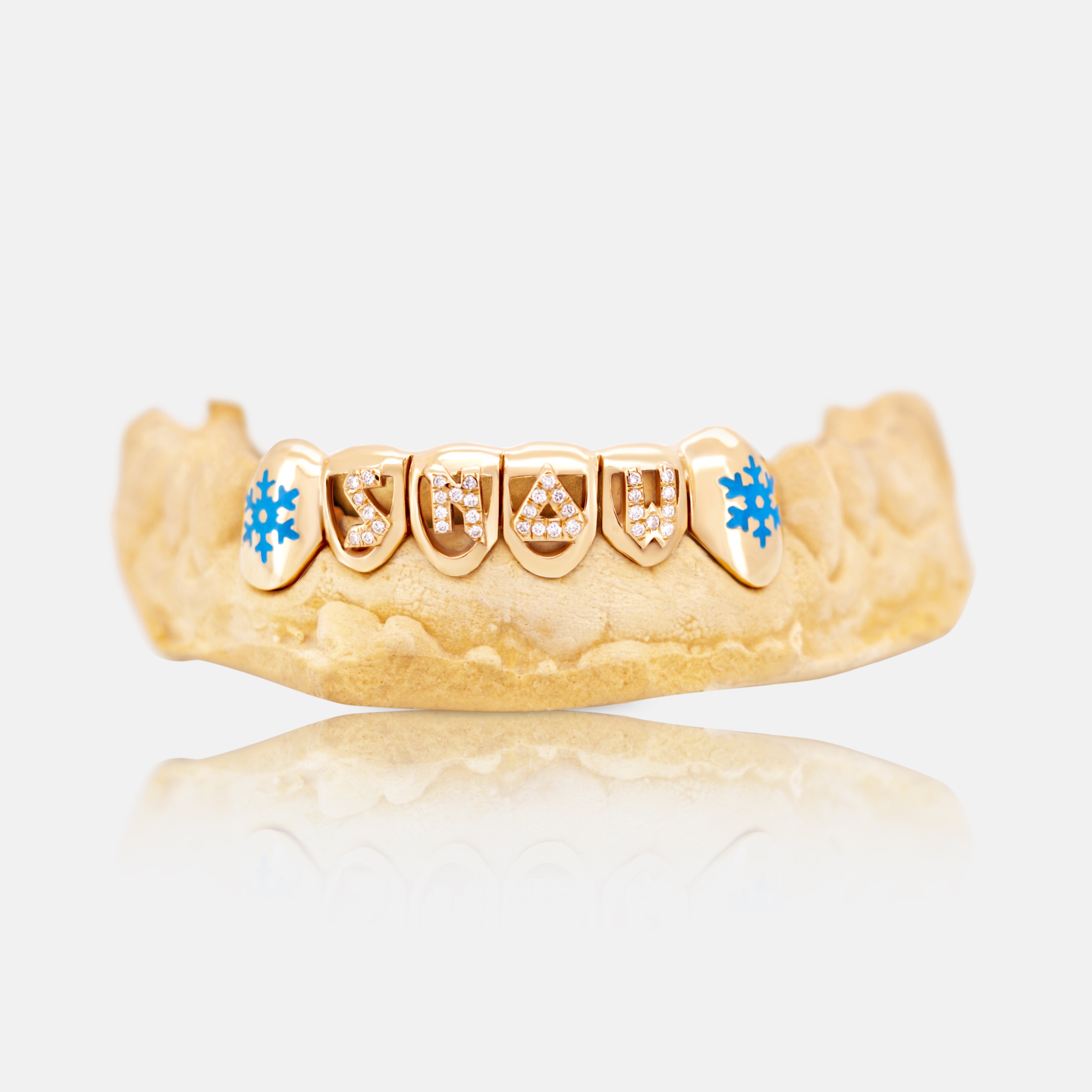 SNOW grillz in gold with diamonds and blue enamel snowflakes by Erick Kraftsman