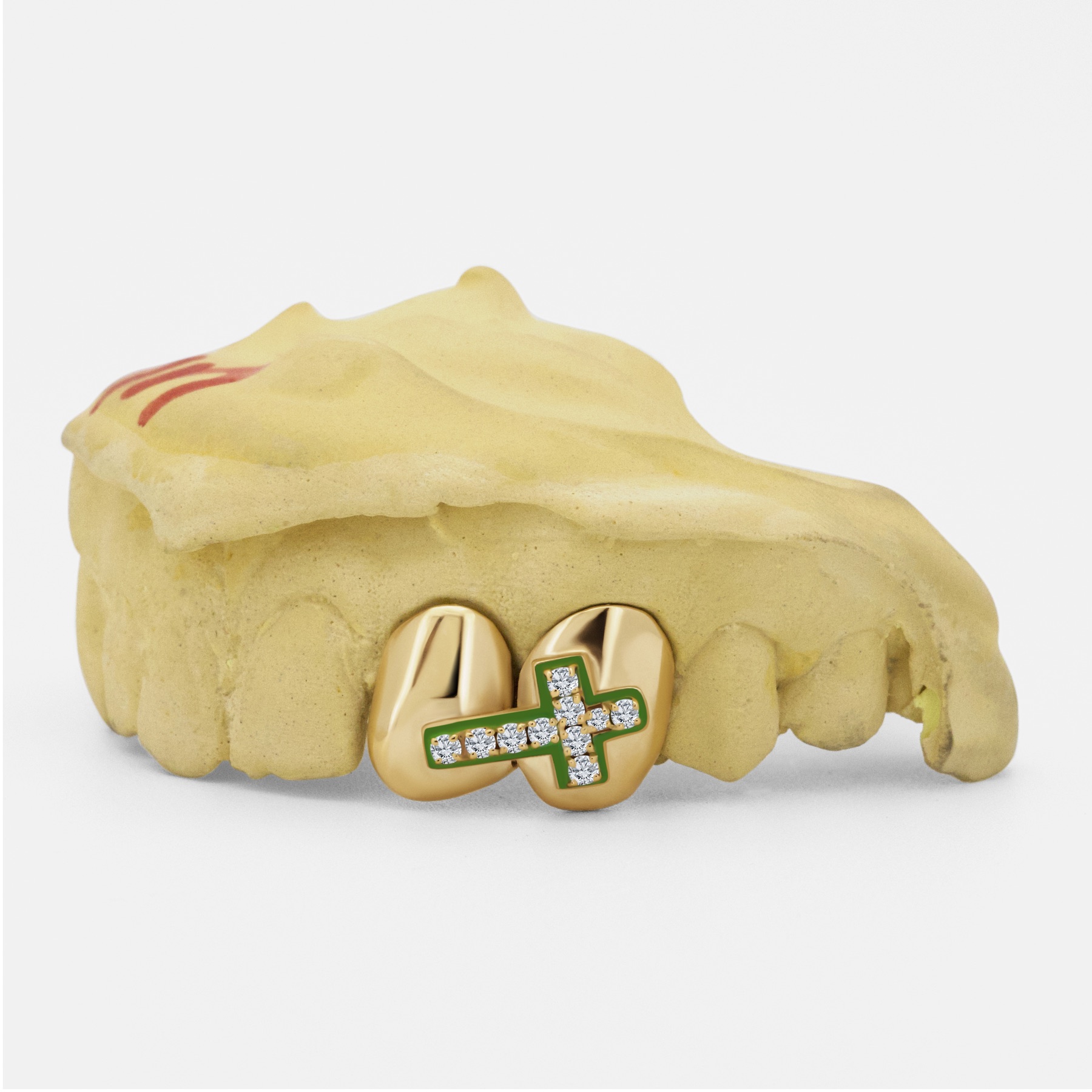 Yellow-gold grillz with a diamond-set green enamel cross by Erick Kraftsman