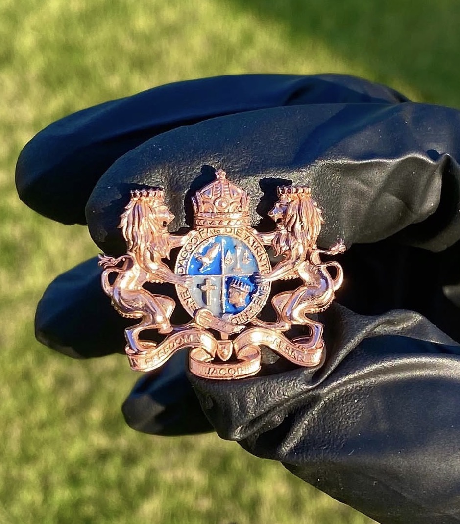 Bespoke rose-gold heraldic brooch created for Freedom Jacob Caesar